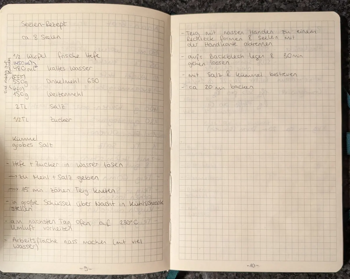 Open notebook with a handwritten recipe for Seelen, a Swabian spelt bread, on squared paper, with older amounts in brackets and a note in the margin